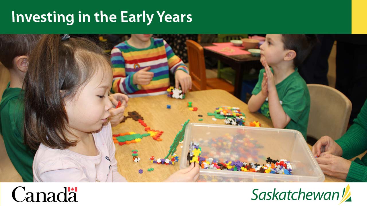 Investing in the early years. A child plays Lego at a table. 