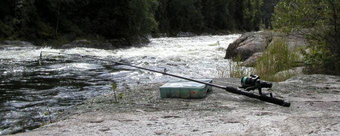 Fishing rod on riverbank