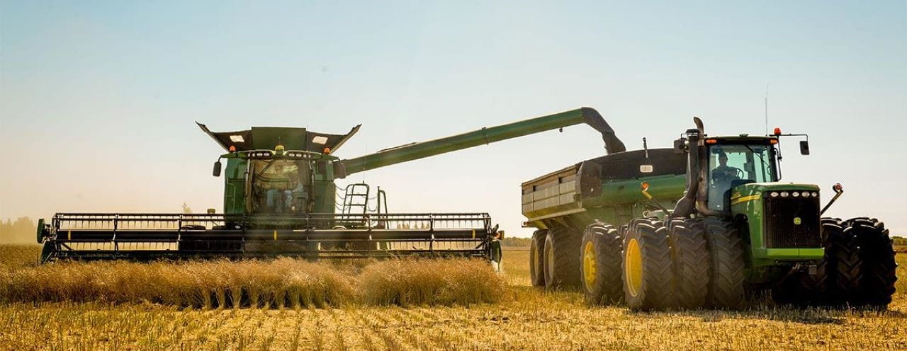 A combine at work harvesting in a field