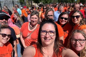 TIES members from Regina dressed in orange shirts pose for a picture on Orange Shirt Day.