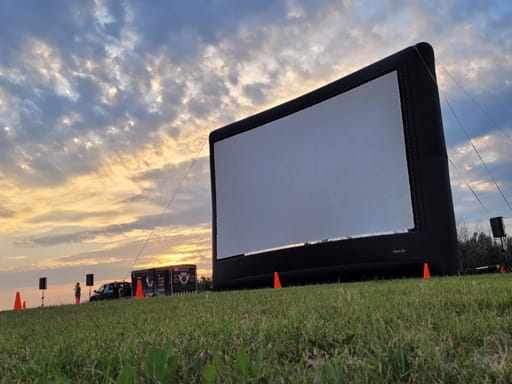 Large outdoor screen at twilight.