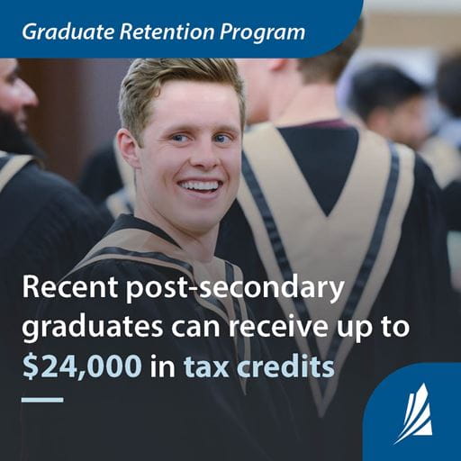 A male graduate with blonde hair, smiling, wearing a black and gold graduation gown. Text reads "Graduate Retention Program - Recent post-secondary graduates can receive up to $24,000 in tax credits."